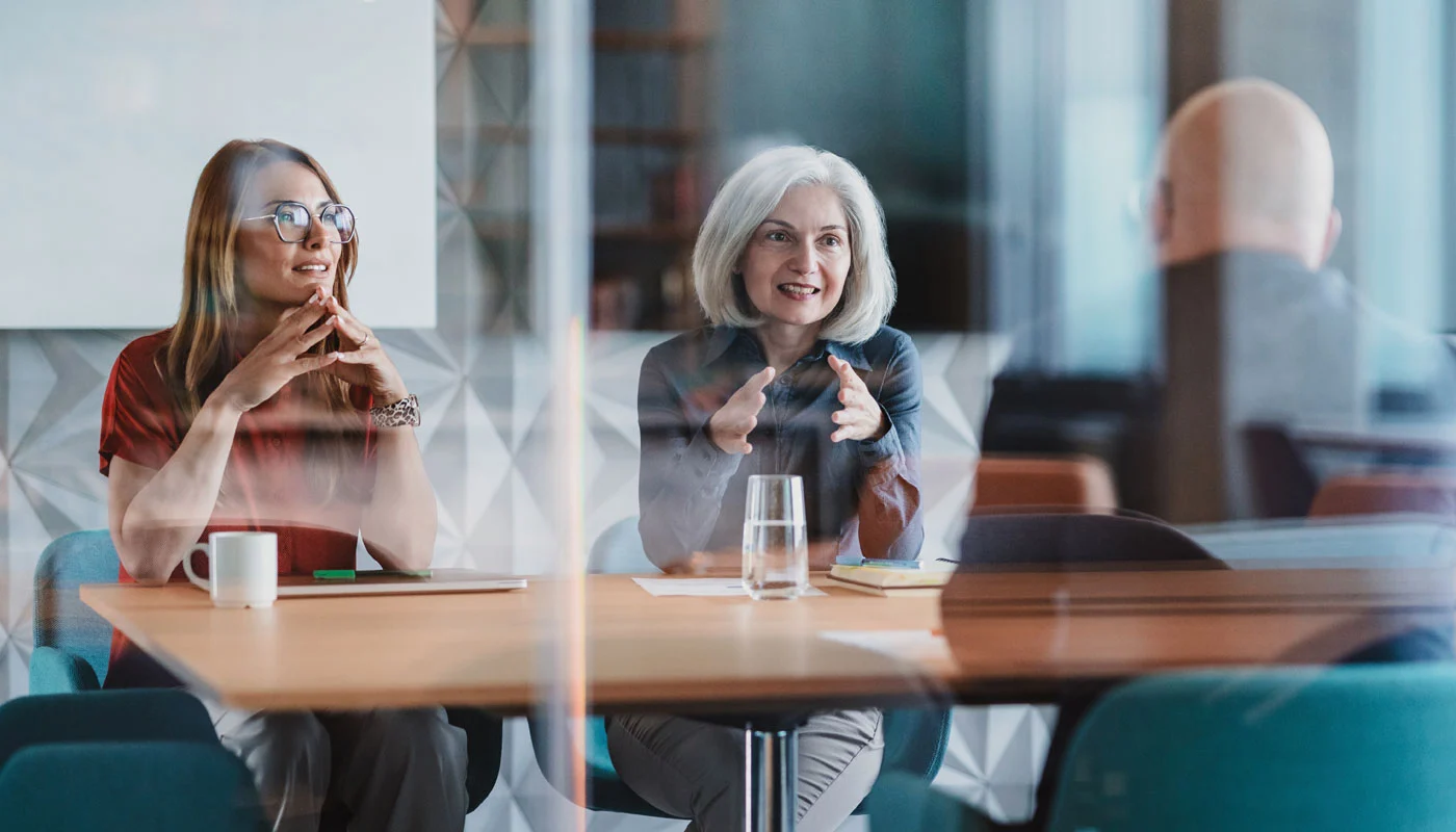 advisors-talking-at-a-table.jpg
